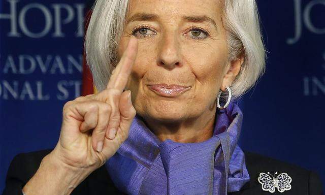 International Monetary Fund Managing Director Lagarde gestures as she speaks about global economy at the Johns Hopkins School of Advanced International Studies in Washington