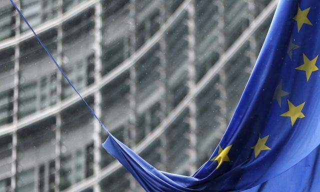 An European Union flag hangs outside the EU Commission headquarters in Brussels