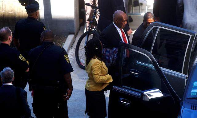 Cosby departs the Montgomery County Courthouse with his publicist, Wyatt, after being found guilty on all counts in his sexual assault retrialin Norristown