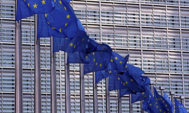 European Union flags fly outside the European Commission headquarters in Brussels