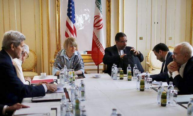 Iranian Foreign Minister Mohammad Javad Zarif meets with U.S. Secretary of State John Kerry at a hotel in Vienna, Austria