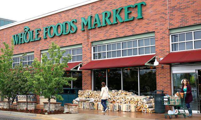 FILE PHOTO: Customers leave the Whole Foods Market in Boulder