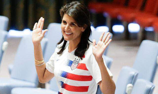 U.S. Ambassador to the U.N. Nikki Haley pose wearing soccer jerseys to commemorate the inauguration of the Wold Cup at the United Nations headquarters in New York City