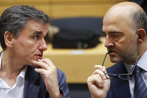 Ebenfalls nicht zu beneiden um seinen Job ist der neue griechische Finanzminister Euklid Tsakalotos (l.), hier im Gespräch mit dem französischen EU-Kommissar Pierre Moscovici.