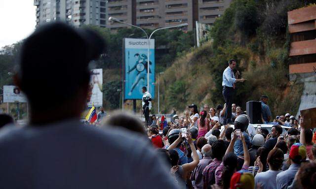 Venezuelan opposition leader Juan Guaido speaks to the crowd during a protest against Venezuelan President Nicolas Maduro's government in Caracas