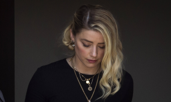 Actress Amber Heard departs the Fairfax County Courthouse following the verdicts in her trial against Johnny Depp in Fai