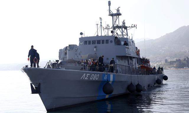 Greek Coast Guard vessel Agios Efstratios, carrying refugees and migrants following a rescue operation, approaches the port of the Greek island of Lesbos