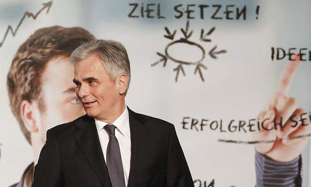 Austrian Chancellor Faymann leaves the podium after a speech in Vienna