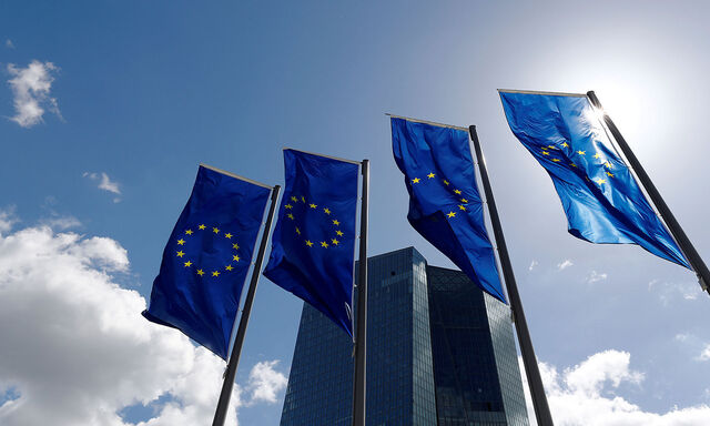 FILE PHOTO: European Union flags flutter outside the European Central Bank (ECB) headquarters in Frankfurt