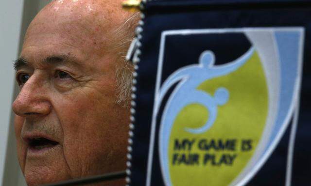 FIFA President Blatter speaks during a news conference after an event celebrating the 100th anniversary of Hong Kong´s Football Association in Hong Kong