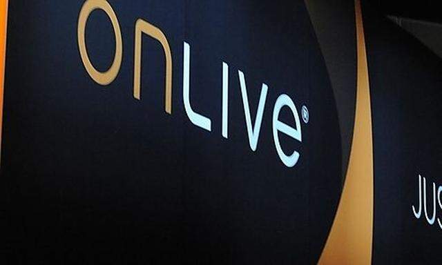 People preview video games at the OnLive booth at E3 in Los Angeles