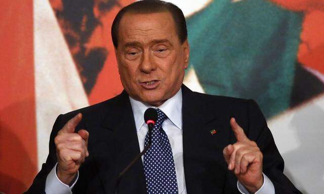 Forza Italia leader Berlusconi gestures during a meeting in Rome
