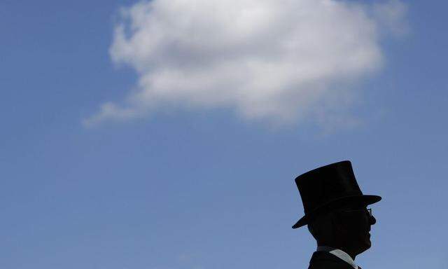 A racegoer arrives for the first day of racing at the Royal Ascot meeting