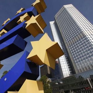 A huge Euro logo is pictured past the headquarters of the European Central Bank (ECB) in Frankfurt