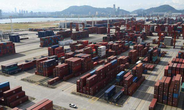 Shipping containers are seen stacked at the Dachan Bay Terminals in Shenzhen