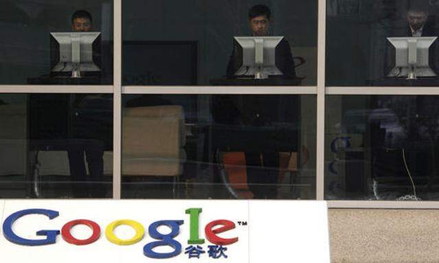 Computer users are seen at the reception area of Googles China headquarters in Beijing Monday, Jan. s China headquarters in Beijing Monday, Jan. 