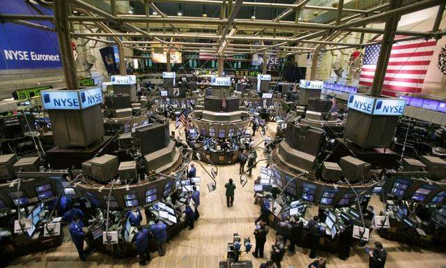 Traders work on the floor of the New York Stock Exchange in New York