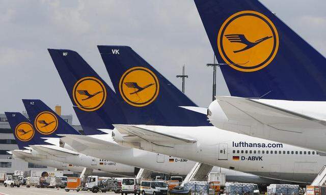 Lufthansa aircrafts sit on the tarmac at Frankfurt airport