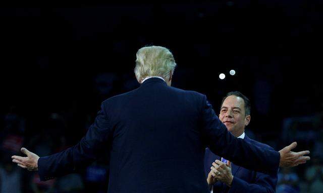 Republican U.S. presidential nominee Donald Trump greets Republican National Committee chairman Reince Priebus during a campaign rally at the Erie Insurance Arena in Erie