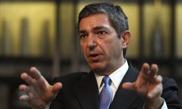 Greek Foreign Minister Lambrinidis gestures during an interview with Reuters in Berlin