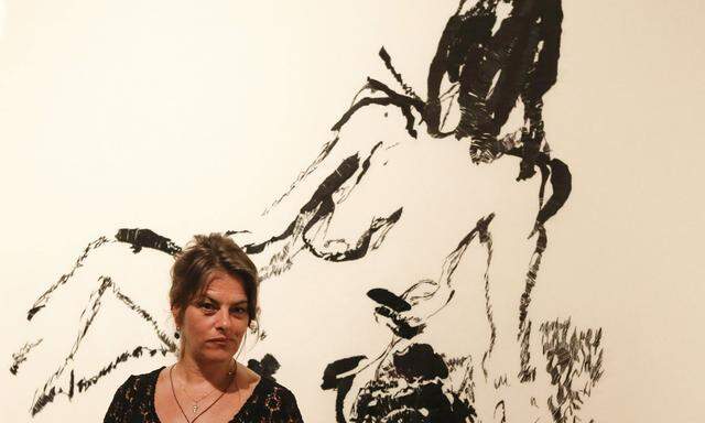 British artist Tracey Emin poses in front of her painting ´Distant Memory´ in Leopold Museum in Vienna