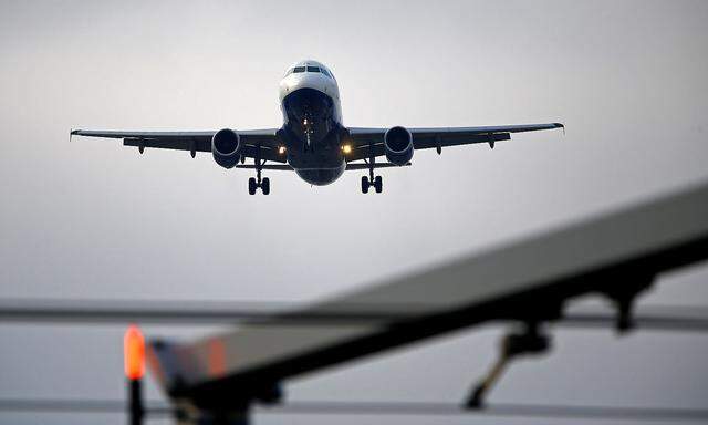 FILE PHOTO: An airplane prepares to land at Cointrin airport in Geneva