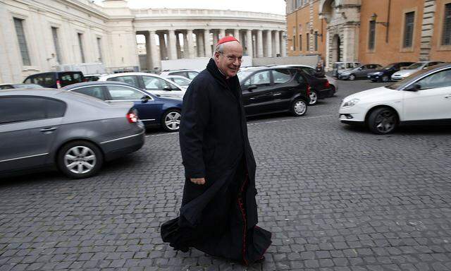 Austrian Cardinal Schonborn arrives to attend a meeting at the Synod Hall in the Vatican