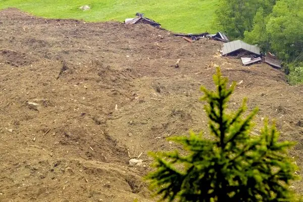 An avalanche made of ice, rock, snow and water reaches the valley floor in Wiler after the collapse of the bay glacier over sheets. 