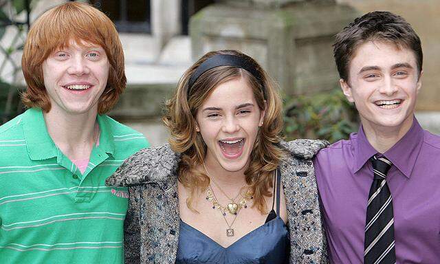 British actors Rupert Grint (L) who plays Ron, Emma Watson (C) who plays Hermione, and Daniel Radcli..