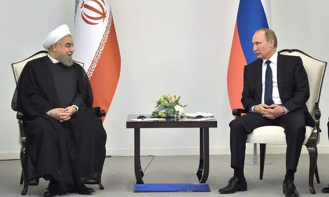Hassan Rohani (l.) und Wladimir Putin