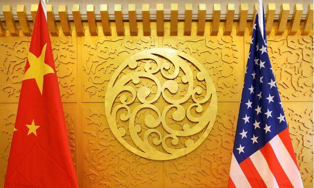 FILE PHOTO: Chinese and U.S. flags are set up for a meeting during a visit by U.S. Secretary of Transportation Elaine Chao at China´s Ministry of Transport in Beijing