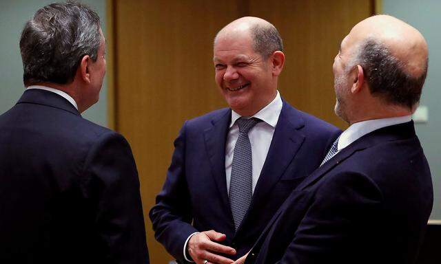 ECB President Mario Draghi, German Finance Minister Olaf Scholz and European Commissioner for Economic and Financial Affairs Pierre Moscovici attend a Euro zone finance ministers meeting in Brussels