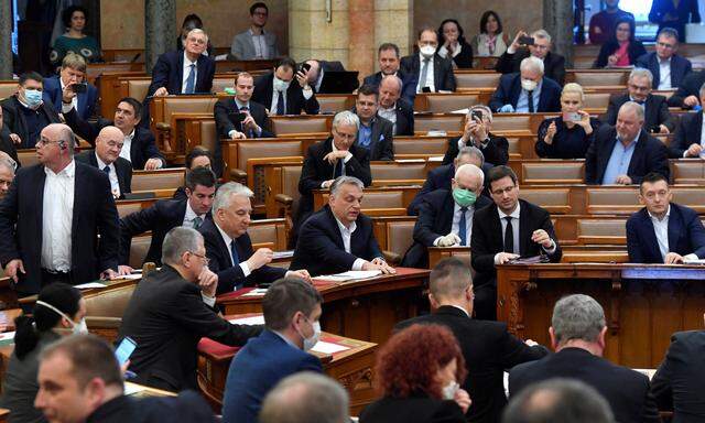 Hungarian Prime Minister Viktor Orban votes the law granting the government special powers to combat the coronavirus disease (COVID-19) crisis at the Hungarian parliament in Budapest