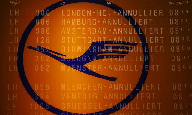 File picture cancelled flights on a flight schedule board and the logo of German air carrier Lufthansa at the Fraport airport in Frankfurt