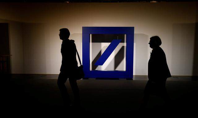 FILE PHOTO: The logo of Deutsche Bank is seen at its headquarters ahead of the bank´s annual general meeting in Frankfurt