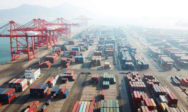 LIANYUNGANG, CHINA - JANUARY 14: Aerial vew of shipping containers sitting stacked at Lianyungang port on January 14, 2