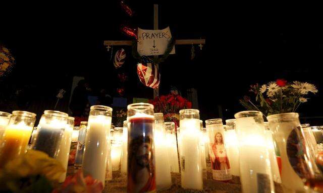Candles are seen at a pop-up memorial in San Bernardino, California, following Wednesday's attack