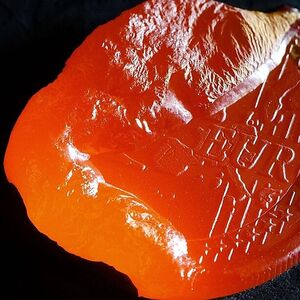 File photo illustration of one euro coin melted with a welding torch