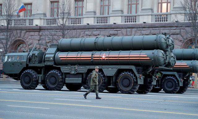 FILE PHOTO: A Russian serviceman walks past air defence systems before a rehearsal for the Victory Day parade in central Moscow