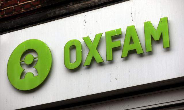 A sign is seen above a branch of Oxfam, in central London