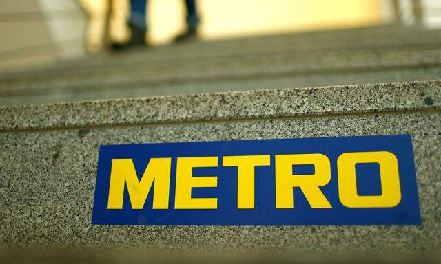 FILE PHOTO: German retailer Metro AG sign is seen on the steps of their headquarters in Duesseldorf
