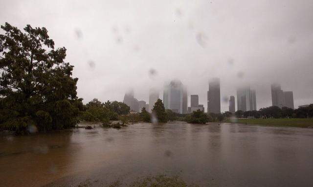 Rain continues to pour down over swollen Buffalo Bayou in Houston Texas