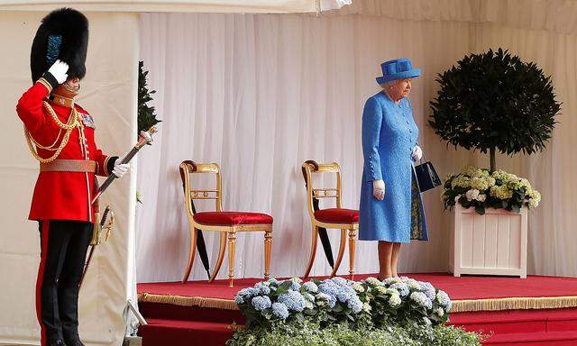 Britain's Queen Elizabeth waits for U.S. President Donald Trump and the First Lady Melania Trump to arrive for tea at Windsor Castle in Windsor