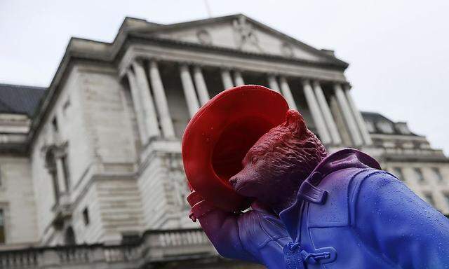 A Paddington Bear sculpture sits in front of the Bank of England in the City of London