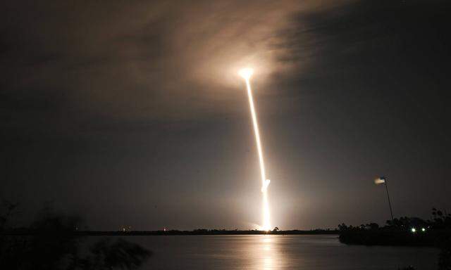 Timed exposure as a SpaceX Falcon 9 rocket launches into the cloud deck as it launches the company s next set of the sec