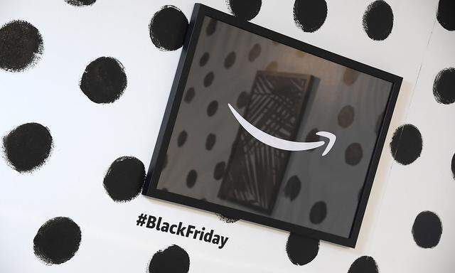 A branded picture frame hangs on a wall inside Amazon's Black Friday pop-up space in London