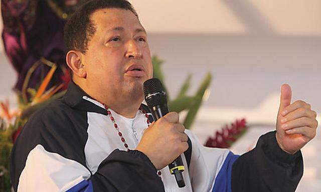 Venezuelan President Hugo Chavez attends a mass to pray for his health in his hometown of Barinas