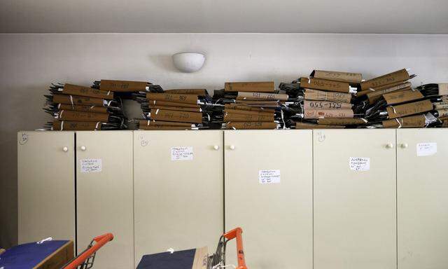 Tax archives are seen piled up inside a tax office in Athens