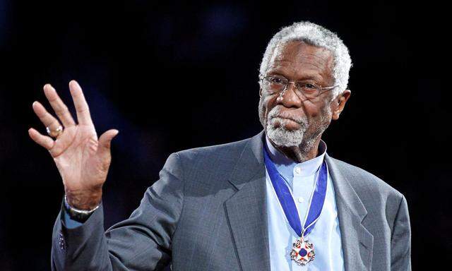 FILE PHOTO: Celtics' legend Russell stands with his Presidential Medal of Freedom during the NBA All-Star basketball game in Los Angeles