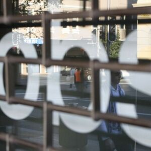 File photo of pedestrians walking past a jobs office in Sydney